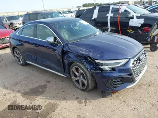 2023 Audi S3 z VIN WAUG3DGY2PA025296, wystawiony jako IAAI lot #41577516 z przebiegiem 23 233 mil mil oraz . Historia ofert i sprzedaży dostępna na DreamBid. Obrazek 1.
