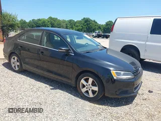 2014 Volkswagen Jetta TDI w/Premium with VIN 3VW3L7AJ6EM420044, listed as a IAAI auction lot 42569620 with 143,482 mi miles and . Bid and sale history available at DreamBid. Image 1.