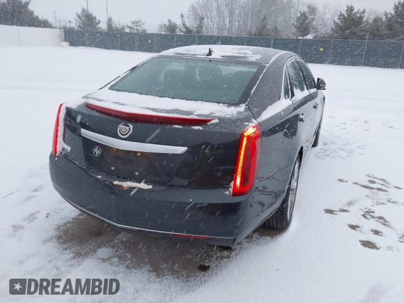 2013 Cadillac XTS with VIN 2G61N5S37D9112979, listed as a IAAI auction lot 41209826 with 83,237 mi miles. Bid and sale history available at carsss.com. Image 4.