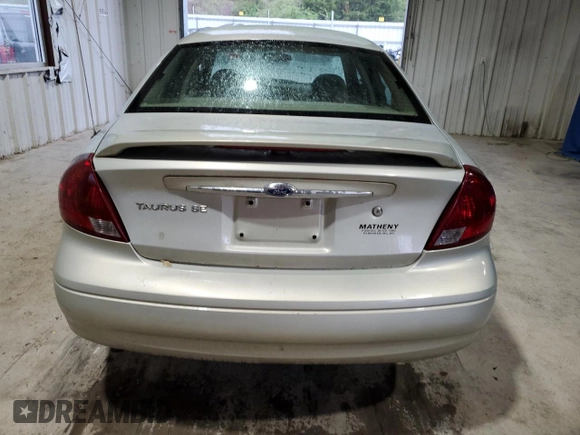 2003 Ford Taurus SE Standard z VIN 1FAFP532X3A195612, wystawiony jako Copart lot #54016645 z przebiegiem 143 168 mil mil oraz Szkoda całkowita • Salvage title. Historia ofert i sprzedaży dostępna na DreamBid. Obrazek 6.