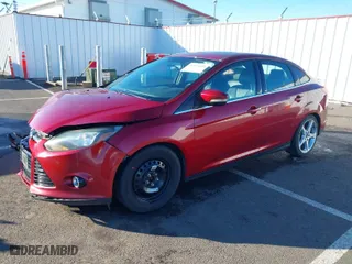 2014 Ford Focus Titanium with VIN 1FADP3J23EL137525, listed as a IAAI auction lot 41562684 with 127,104 mi miles. Bid and sale history available at carsss.com. Image 2.