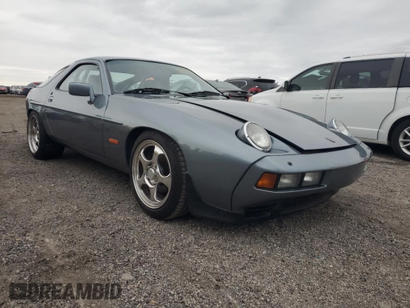 1983 Porsche 928 z VIN WP0ZZZ92ZDS841622, wystawiony jako Copart lot #76995304 z przebiegiem 83 862 mil mil oraz Szkody całkowita. Historia ofert i sprzedaży dostępna na DreamBid. Obrazek 4.