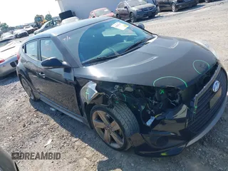 2013 Hyundai Veloster Turbo z VIN KMHTC6AE5DU174142, wystawiony jako IAAI lot #42424749 z przebiegiem 69 744 mil mil oraz . Historia ofert i sprzedaży dostępna na DreamBid. Obrazek 1.