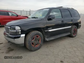 2002 GMC Yukon SLT with VIN 1GKEC13T32R328511, listed as a Copart auction lot 43752705 with 220,309 mi miles and Salvage Title. Bid and sale history available at carsss.com. Image 1.