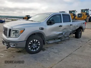 2016 Nissan Titan SL z VIN 1N6BA1F41GN507358, wystawiony jako Copart lot #58373655 z przebiegiem 193 596 mil mil oraz Szkoda całkowita • Salvage title. Historia ofert i sprzedaży dostępna na DreamBid. Obrazek 1.