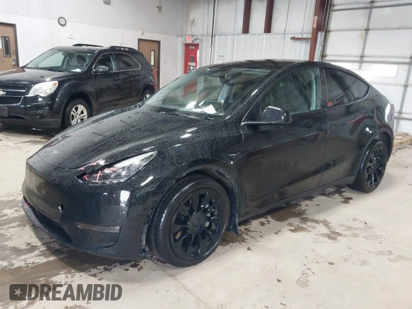 2023 Tesla Model Y Long Range with VIN 7SAYGDEE2PF808844, listed as a IAAI auction lot 41941905 with 39,951 mi miles and . Bid and sale history available at carsss.com. Image 2.