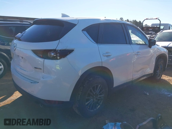 2020 Mazda CX-5 Touring with VIN JM3KFBCM0L0828207, listed as a IAAI auction lot 41305801 with 56,500 mi miles and . Bid and sale history available at DreamBid. Image 4.