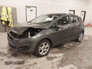 2015 Ford Fiesta SE z VIN 3FADP4EJ8FM138306, wystawiony jako IAAI lot #41227124 z przebiegiem 106 741 mil mil oraz . Historia ofert i sprzedaży dostępna na DreamBid. Obrazek 17.