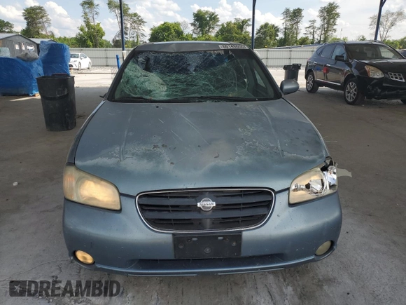 2000 Nissan Maxima GXE with VIN JN1CA31A1YT223132, listed as a Copart auction lot 60148655 with 269,258 mi miles and Salvage title. Bid and sale history available at DreamBid. Image 5.