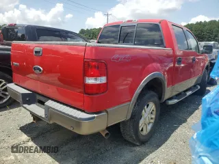 2004 Ford F-150 XLT with VIN 1FTPW14504KD65703, listed as a Copart auction lot 58792215 with 303,083 mi miles and Salvage title. Bid and sale history available at DreamBid. Image 3.