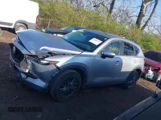 2020 Mazda CX-5 Touring with VIN JM3KFACM5L0766698, listed as a IAAI auction lot 42006157 with 80,288 mi miles and . Bid and sale history available at carsss.com. Image 14.