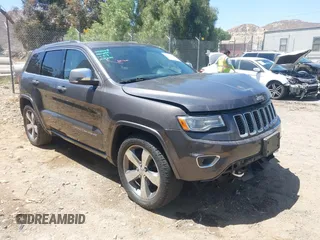 2015 Jeep Grand Cherokee Overland with VIN 1C4RJFCG7FC839778, listed as a IAAI auction lot 42490111 with 160,040 mi miles and . Bid and sale history available at DreamBid. Image 1.