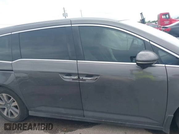 2016 Honda Odyssey Touring Elite with VIN 5FNRL5H97GB010048, listed as a IAAI auction lot 40212711 with 119,009 mi miles and . Bid and sale history available at DreamBid. Image 13.