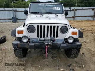 2000 Jeep Wrangler Sahara with VIN 1J4FA59SXYP760278, listed as a Copart auction lot 60402485 with 192,161 mi miles and Salvage title. Bid and sale history available at DreamBid. Image 5.
