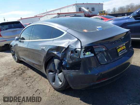 2018 Tesla Model 3 Long Range Battery z VIN 5YJ3E1EB1JF093175, wystawiony jako IAAI lot #41766128 z przebiegiem Nie podano mil oraz . Historia ofert i sprzedaży dostępna na DreamBid. Obrazek 3.