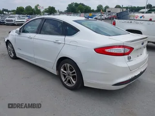 2015 Ford Fusion SE Hybrid with VIN 3FA6P0LU2FR305597, listed as a IAAI auction lot 42168292 with 97,688 mi miles and . Bid and sale history available at DreamBid. Image 3.