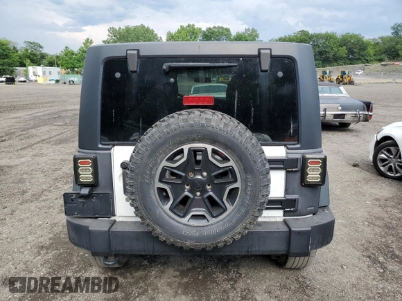 2014 Jeep Wrangler Unlimited Rubicon with VIN 1C4HJWFG4EL114743, listed as a Copart auction lot 61397575 with 110,222 mi miles and Salvage title. Bid and sale history available at DreamBid. Image 6.