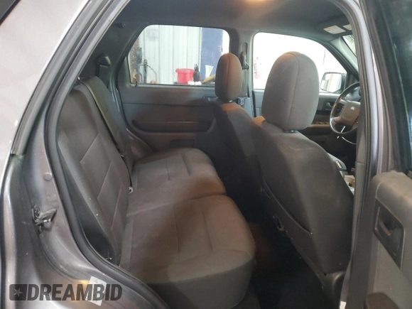 2012 Ford Escape XLT z VIN 1FMCU9DG8CKA93402, wystawiony jako Copart lot #62266845 z przebiegiem 196 779 mil mil oraz Szkoda całkowita • Salvage title. Historia ofert i sprzedaży dostępna na DreamBid. Obrazek 11.