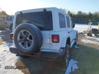 2021 Jeep Wrangler Unlimited Sahara with VIN 1C4HJXEG2MW827385, listed as a IAAI auction lot 41534476 with 29,489 mi miles and . Bid and sale history available at DreamBid. Image 4.