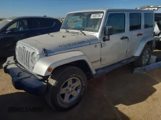 2012 Jeep Wrangler Unlimited Call of Duty MW3 with VIN 1C4BJWFG3CL103865, listed as a Copart auction lot 74237754 with 104,232 mi miles and Salvage title. Bid and sale history available at DreamBid. Image 1.