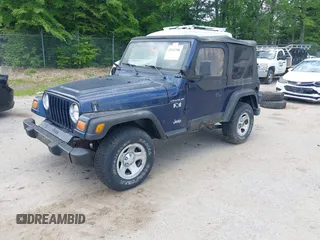 2002 Jeep Wrangler X z VIN 1J4FA39S82P735794, wystawiony jako IAAI lot #42411386 z przebiegiem 141 219 mil mil oraz . Historia ofert i sprzedaży dostępna na DreamBid. Obrazek 2.