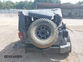 2014 Jeep Wrangler Sport with VIN 1C4AJWAGXEL233647, listed as a IAAI auction lot 39993785 with Not Provided miles and . Bid and sale history available at DreamBid. Image 17.