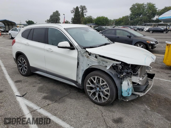 2021 BMW X1 xDrive28i with VIN WBXJG9C09M5U35093, listed as a Copart auction lot 65509155 with 46,875 mi miles and Salvage title. Bid and sale history available at DreamBid. Image 4.