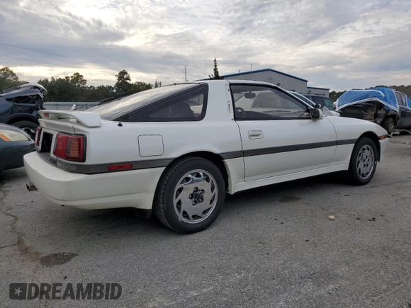1988 Toyota Supra с VIN JT2MA71J0J0088041, выставлен на аукционе Copart как лот 84402804 с пробегом 195 921 миль миль и Чистый • Clean title. История ставок и продаж доступна на DreamBid. Изображение 3.
