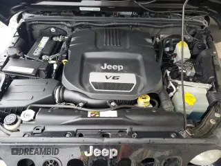 2014 Jeep Wrangler Unlimited Sport with VIN 1C4BJWDG2EL319714, listed as a Copart auction lot 47924575 with 129,294 mi miles and Salvage Title. Bid and sale history available at DreamBid. Image 11.