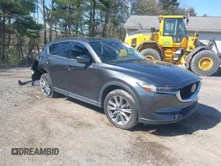 2020 Mazda CX-5 Grand Touring with VIN JM3KFBDM1L0821975, listed as a IAAI auction lot 40088794 with 68,895 mi miles and . Bid and sale history available at DreamBid. Image 1.