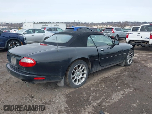 1997 Jaguar XK with VIN SAJGX274XVC017622, listed as a IAAI auction lot 41614339 with 94,298 mi miles and . Bid and sale history available at DreamBid. Image 4.