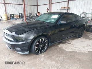 2012 Ford Mustang V6 Premium with VIN 1ZVBP8AM5C5223787, listed as a IAAI auction lot 42141944 with 73,960 mi miles. Bid and sale history available at carsss.com. Image 2.