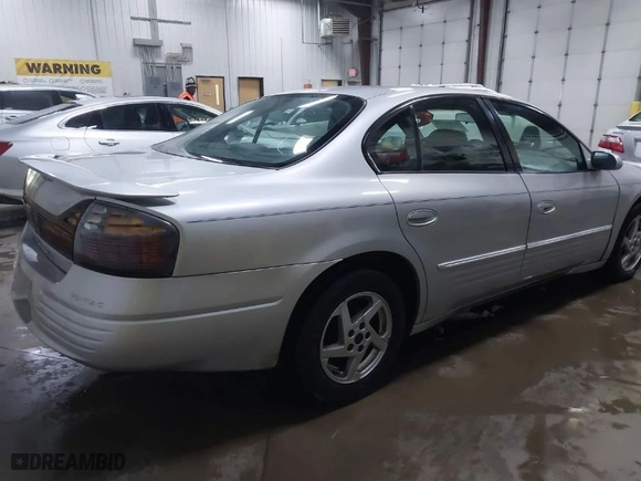 2003 Pontiac Bonneville SE with VIN 1G2HX52K734152756, listed as a IAAI auction lot 41482255 with 219,472 mi miles. Bid and sale history available at carsss.com. Image 4.