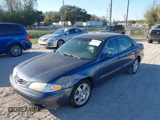 2002 Mazda 626 LX with VIN 1YVGF22D925287959, listed as a IAAI auction lot 41610932 with 122,333 mi miles. Bid and sale history available at carsss.com. Image 6.
