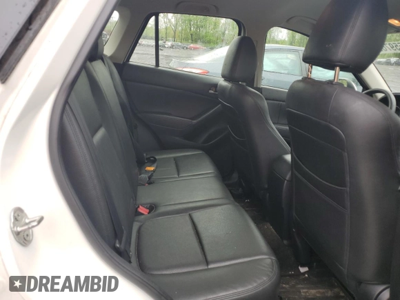 2016 Mazda CX-5 Sport z VIN JM3KE4BY2G0802376, wystawiony jako Copart lot #55976585 z przebiegiem 112 600 mil mil oraz Szkoda całkowita • Salvage title. Historia ofert i sprzedaży dostępna na DreamBid. Obrazek 10.