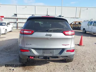 2015 Jeep Cherokee Trailhawk with VIN 1C4PJMBS3FW662307, listed as a IAAI auction lot 41778932 with 64,569 mi miles. Bid and sale history available at carsss.com. Image 16.