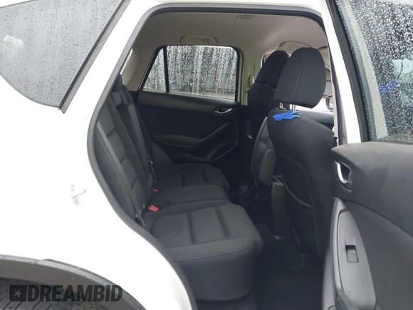2016 Mazda CX-5 Touring with VIN JM3KE4CY0G0903723, listed as a IAAI auction lot 41966516 with 107,569 mi miles. Bid and sale history available at carsss.com. Image 8.