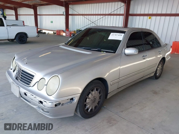 2001 Mercedes-Benz E-Class with VIN WDBJF65J81B215945, listed as a IAAI auction lot 41707410 with 227,668 mi miles. Bid and sale history available at carsss.com. Image 2.