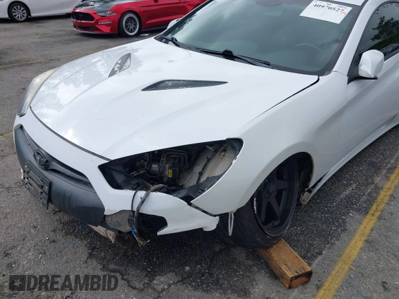 2014 Hyundai Genesis Coupe R-Spec z VIN KMHHT6KD3EU118357, wystawiony jako IAAI lot #40970527 z przebiegiem 94 174 mil mil oraz . Historia ofert i sprzedaży dostępna na DreamBid. Obrazek 6.