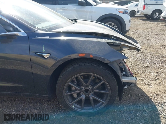 2019 Tesla Model 3 Mid Range with VIN 5YJ3E1EA5KF327679, listed as a IAAI auction lot 41804379 with 87,208 mi miles and . Bid and sale history available at DreamBid. Image 20.