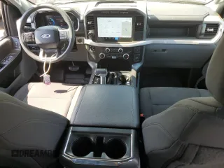2023 Ford F-150 Lightning Pro with VIN 1FT6W1EVXPWG44972, listed as a Copart auction lot 60303485 with 19,788 mi miles and Salvage title. Bid and sale history available at DreamBid. Image 8.