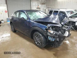 2023 Mazda CX-30 S with VIN 3MVDMBAM1PM565897, listed as a Copart auction lot 52426115 with 19,648 mi miles and Salvage title. Bid and sale history available at DreamBid. Image 4.