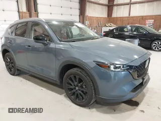 2023 Mazda CX-5 S Carbon Edition z VIN JM3KFBCM3P0289782, wystawiony jako IAAI lot #42052641 z przebiegiem 16 665 mil mil oraz . Historia ofert i sprzedaży dostępna na DreamBid. Obrazek 1.