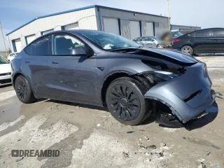 2023 Tesla Model Y Long Range z VIN 7SAYGDEE7PF822934, wystawiony jako Copart lot #49285285 z przebiegiem Nie podano mil oraz Szkoda całkowita • Salvage title. Historia ofert i sprzedaży dostępna na DreamBid. Obrazek 4.
