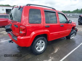 2002 Jeep Liberty Limited z VIN 1J8GL58K42W262492, wystawiony jako IAAI lot #42121270 z przebiegiem 167 662 mil mil oraz . Historia ofert i sprzedaży dostępna na DreamBid. Obrazek 4.