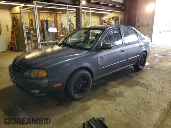 2003 Kia Spectra GS z VIN KNAFB161135104592, wystawiony jako Copart lot #52097205 z przebiegiem 119 206 mil mil oraz Szkoda całkowita • Salvage title. Historia ofert i sprzedaży dostępna na DreamBid. Obrazek 1.