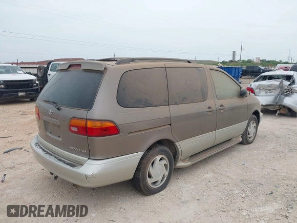 1999 Toyota Sienna LE with VIN 4T3ZF13C5XU164075, listed as a IAAI auction lot 42063741 with 93,407 mi miles. Bid and sale history available at carsss.com. Image 4.