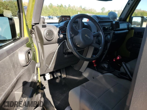 2008 Jeep Wrangler Rubicon с VIN 1J4GA64198L518646, выставлен на аукционе Copart как лот 82381084 с пробегом Не указан миль и Списание • Salvage title. История ставок и продаж доступна на DreamBid. Изображение 8.