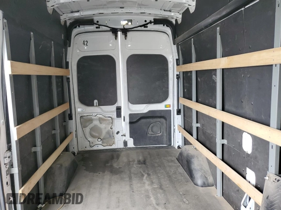 2021 Ford Transit Cargo с VIN 1FTBR1X87MKA53899, выставлен на аукционе Copart как лот 53969705 с пробегом 94 115 миль миль и Списание • Salvage title. История ставок и продаж доступна на DreamBid. Изображение 10.