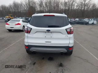 2018 Ford Escape SE z VIN 1FMCU9GD2JUC77186, wystawiony jako IAAI lot #41308133 z przebiegiem 123 156 mil mil oraz . Historia ofert i sprzedaży dostępna na DreamBid. Obrazek 16.